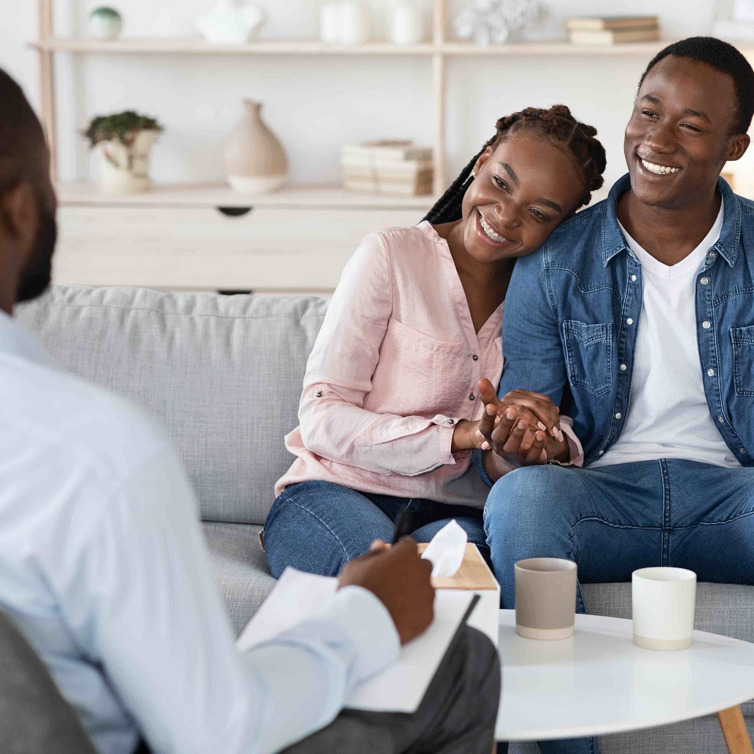 family-counseling-young-happy-black-couple-sitting-F94FZH2